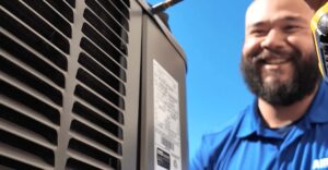 smiling hvac tech looking at work